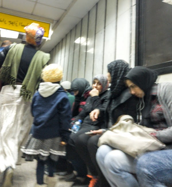 People sitting around waiting for their visa renewal/extension in Cairo, back at the Mogamma