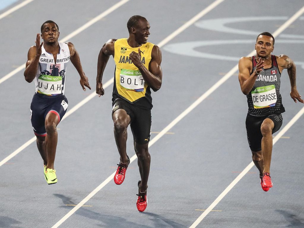 Husain Bolt smiling as he wins a world record. How fast should we be able to run the 100m sprint?