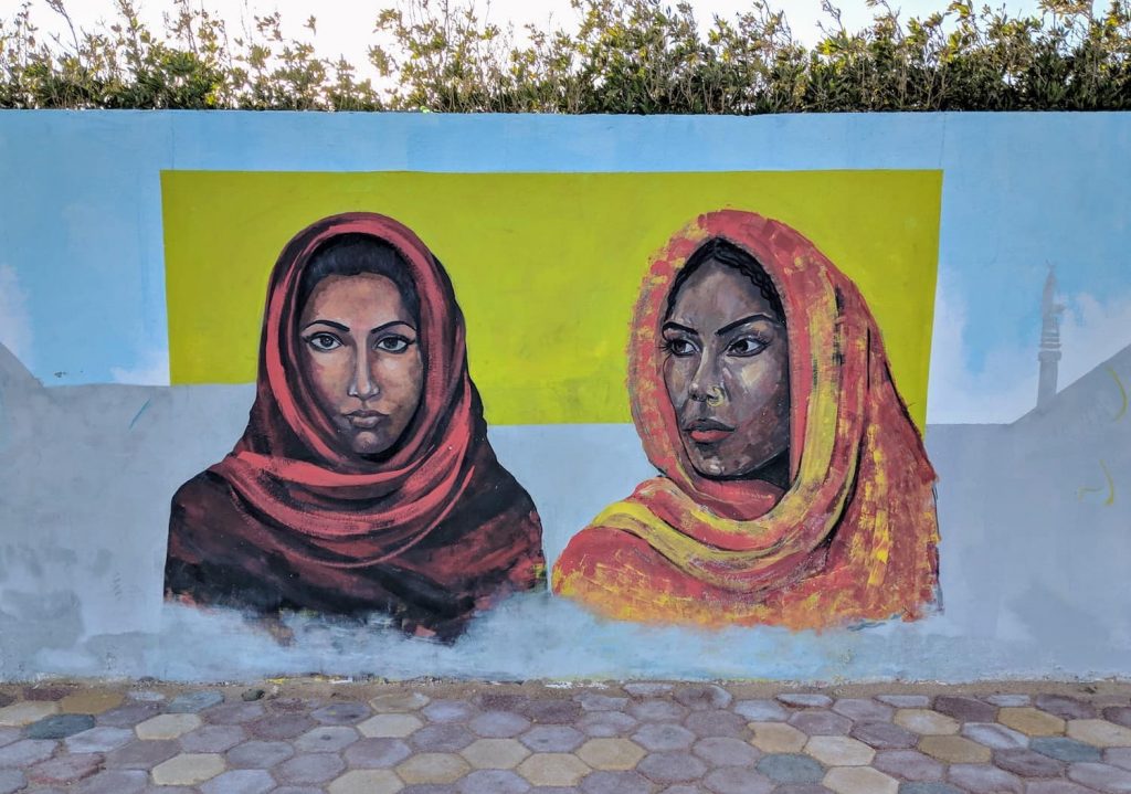 Two women in shawls/hijab (Islamic Headdress). Graffiti on a wall in Dahab, Egypt.