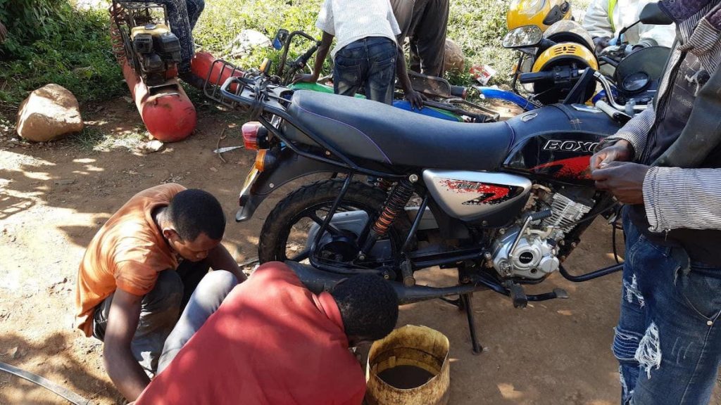 My motorcycle being repaired, thwarting day 10 of running in Iten