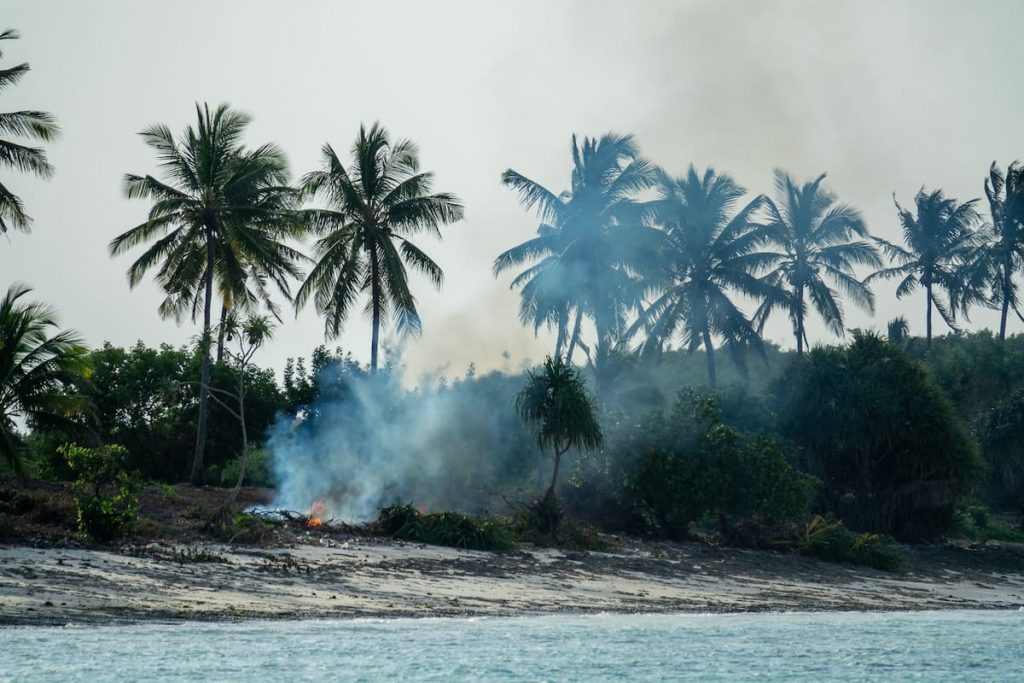 A plastic and waste trash fire in Zanzibar, Tanzania