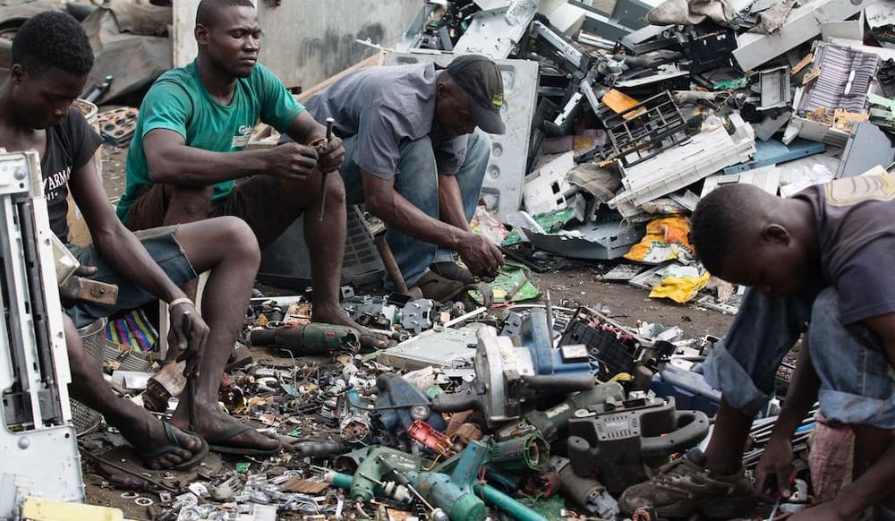 E-waste sorters at a tip/recycling center at Accra, Ghana