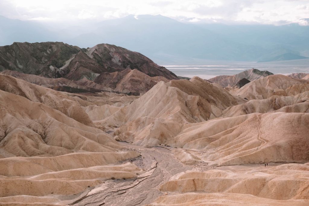 Zabriskie Point attraction in Death Valley, with mountains in background