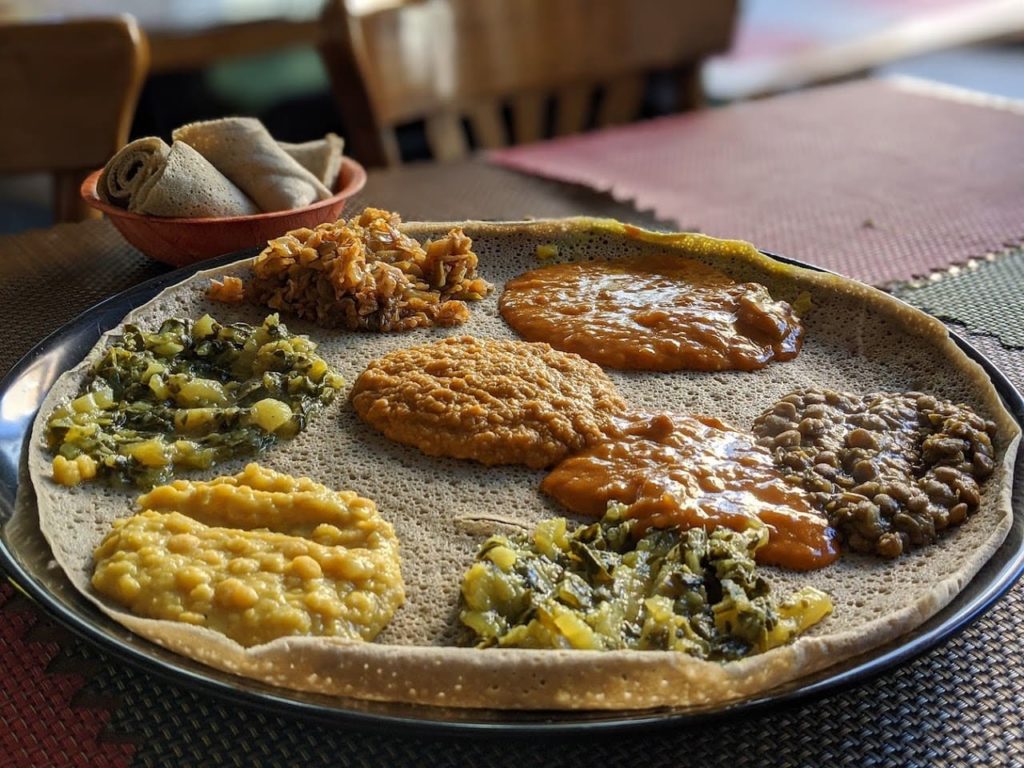 Injera with curries, ethiopian food in tel aviv