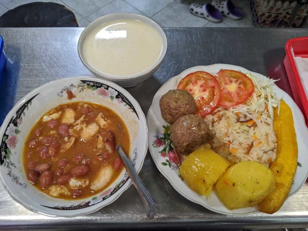 Menu del dia in Medellin, Colombia. Albondigas (meatballs), and a bean soup (frijoles). And a bowl of claro (corn with milk)