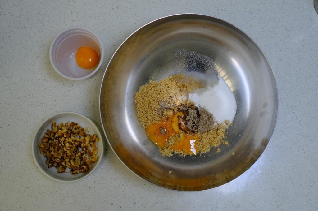 Ingredients for Persian walnut cookies in a bowl